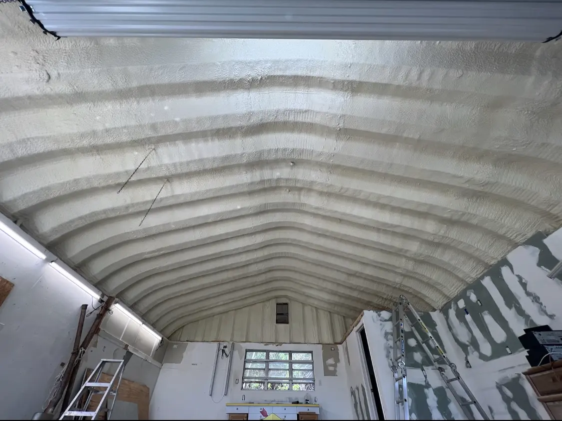 Spray polyurethane foam applied to the underside of a metal roof deck in Morehead